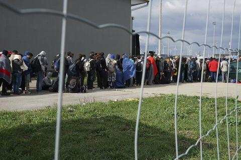 A line of Syrian refugees crossing the border of Hungary and Austria [Source: Wikipedia]